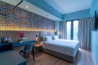 Een bed of bedden in een kamer bij ibis Styles Kuala Lumpur Bukit Bintang