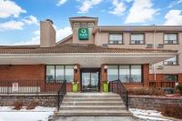 a building with a green exit sign on it at Quality Hotel in Burlington