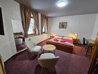 Postel nebo postele na pokoji v ubytování Hotel Pivovarská bašta