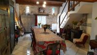 a dining room with a long table and chairs at Le Mas Nomade in Callian