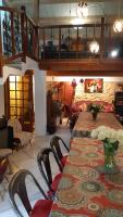 a dining room with a table and chairs with flowers on it at Le Mas Nomade in Callian