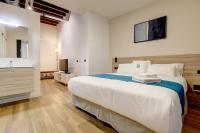 Posteľ alebo postele v izbe v ubytovaní Aqua Apartments Málaga