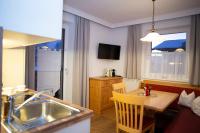 TV a/nebo společenská místnost v ubytování Appartement-Gästehaus Ursula