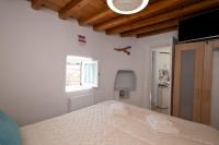 Posteľ alebo postele v izbe v ubytovaní Casetta Annaise Mykonos-Myconian House for two