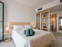 A bed or beds in a room at CocoBeach Mojácar