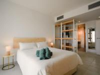 A bed or beds in a room at CocoBeach Mojácar