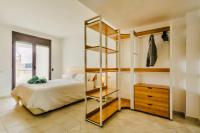 A bed or beds in a room at CocoBeach Mojácar