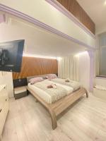 A bed or beds in a room at Yes, yes! lovely apartment good amenities Budapest center