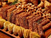 a display of different types of pastries and pies at Hotel Grand Tiara Minaminagoya in Anjo