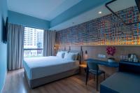 Een bed of bedden in een kamer bij ibis Styles Kuala Lumpur Bukit Bintang