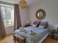 Łóżko lub łóżka w pokoju w obiekcie Home Emoi