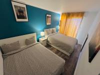 Łóżko lub łóżka w pokoju w obiekcie Cosy Duplex avec Parking à Paris 19 by immo kit bnb