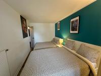 Łóżko lub łóżka w pokoju w obiekcie Cosy Duplex avec Parking à Paris 19 by immo kit bnb