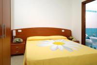 Posteľ alebo postele v izbe v ubytovaní Hotel La Marina