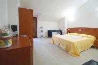 Posteľ alebo postele v izbe v ubytovaní Hotel La Marina