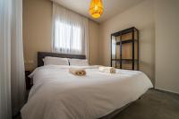 Ein Bett oder Betten in einem Zimmer der Unterkunft Sun City - By Harim