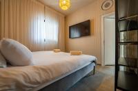 Ein Bett oder Betten in einem Zimmer der Unterkunft Sun City - By Harim