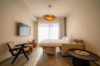 Ein Bett oder Betten in einem Zimmer der Unterkunft Sun City - By Harim