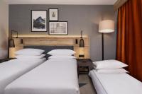 Postel nebo postele na pokoji v ubytování Four Points by Sheraton Bansko