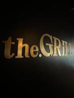 a sign that reads the fifth written in gold at Al Sawadi Beach Resort & Spa in Barka