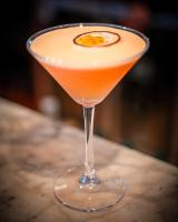 a drink in a glass sitting on a table at Cotswold House Hotel and Spa - "A Bespoke Hotel" in Chipping Campden