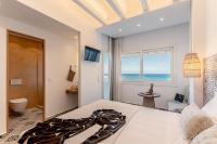 Posteľ alebo postele v izbe v ubytovaní Flèria Seaview Suites