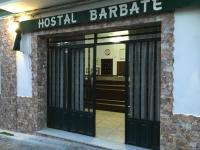 an entrance to a hostel barbara with black doors at Hostal Barbate in Barbate