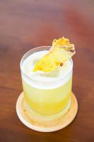 a small yellow cake on a plate on a table at Casa Mario's in Coron