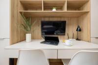 TV a/nebo společenská místnost v ubytování Business Studio Apartments Wolska by Noclegi Renters
