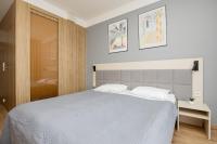 Postel nebo postele na pokoji v ubytování Business Studio Apartments Wolska by Noclegi Renters