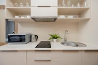 Kuchyň nebo kuchyňský kout v ubytování Business Studio Apartments Wolska by Noclegi Renters