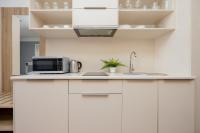 Kuchyň nebo kuchyňský kout v ubytování Business Studio Apartments Wolska by Noclegi Renters