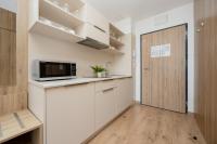 Kuchyň nebo kuchyňský kout v ubytování Business Studio Apartments Wolska by Noclegi Renters