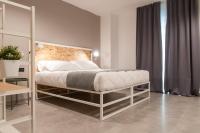 Posteľ alebo postele v izbe v ubytovaní Residence Hotel Moderno