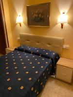 Posteľ alebo postele v izbe v ubytovaní Hostal Bonavista