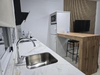 Kuchyňa alebo kuchynka v ubytovaní Apartamentos Casa Sardina
