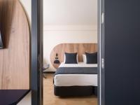 Postel nebo postele na pokoji v ubytování Sercotel Playa Canteras