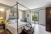 Postel nebo postele na pokoji v ubytování Aerinon Guesthouse