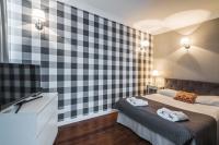 Posteľ alebo postele v izbe v ubytovaní Triton Park Apartments