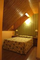 Postel nebo postele na pokoji v ubytování Apartamentos Fidalgo