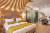 A bed or beds in a room at Agave Suites