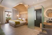 A bed or beds in a room at Agave Suites
