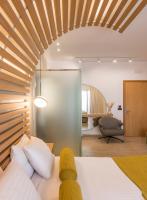 A bed or beds in a room at Agave Suites