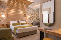 A bed or beds in a room at Agave Suites