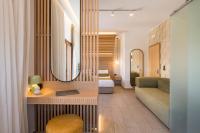A bed or beds in a room at Agave Suites