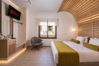 A bed or beds in a room at Agave Suites