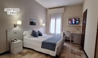 A bed or beds in a room at Hotel Mediterranée