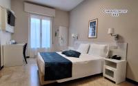 A bed or beds in a room at Hotel Mediterranée