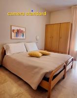 A bed or beds in a room at Hotel Mediterranée