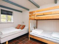 Postel nebo postele na pokoji v ubytování 14 person holiday home in Ulfborg